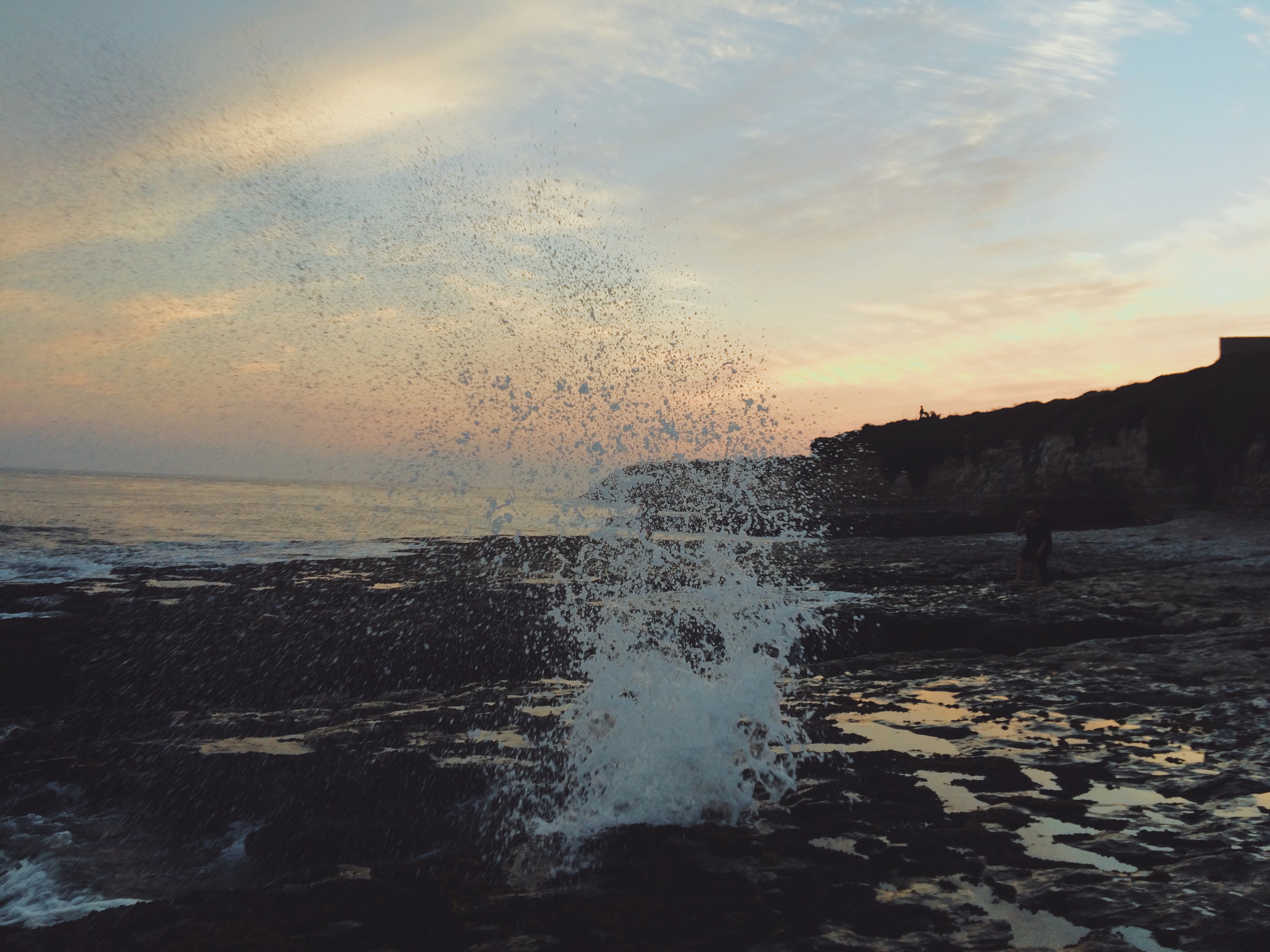 waves splashing on rocks